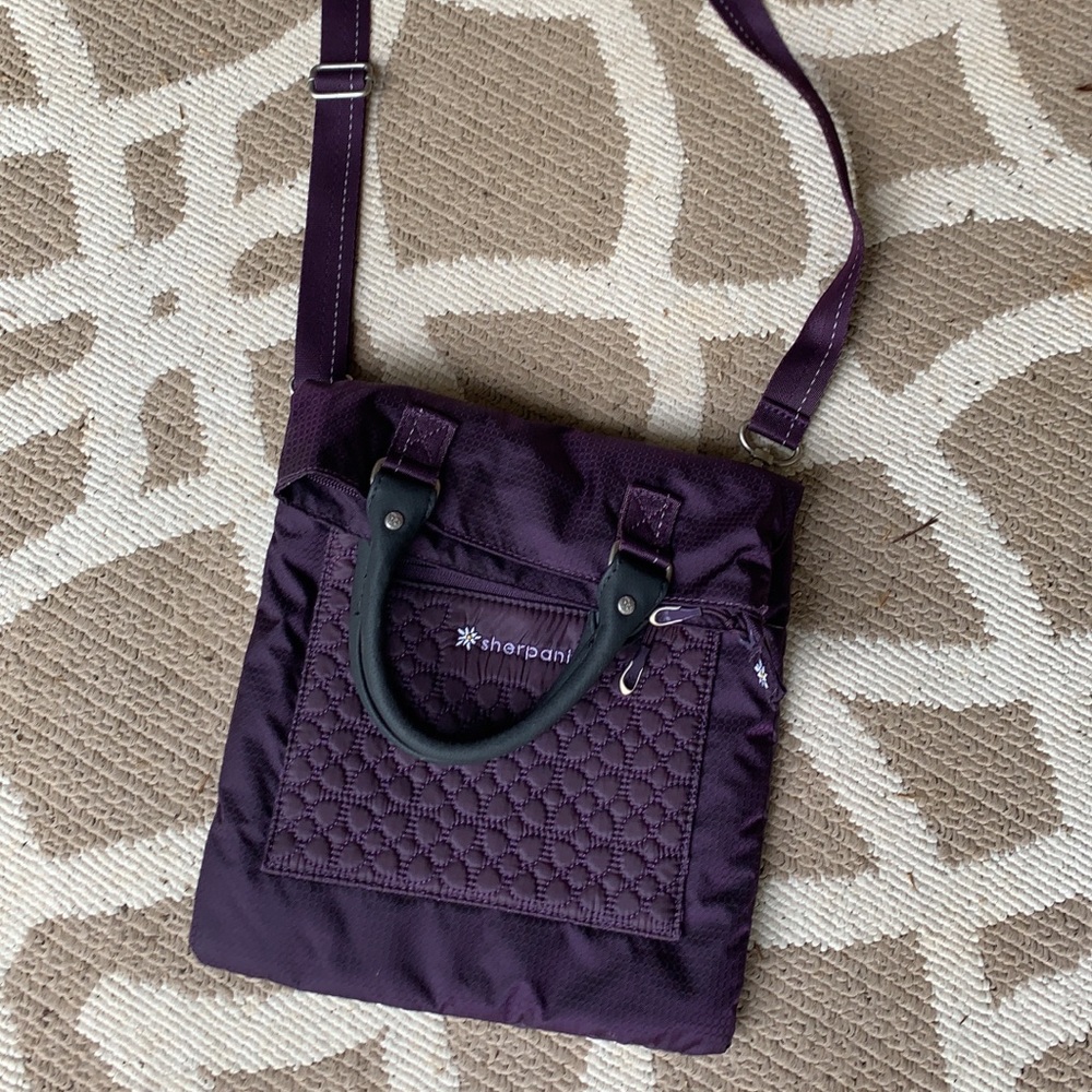 Sherpani cross body purse, plum color
